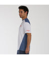 Camiseta bullpadel ciron en color blanco y azul. De perfil.